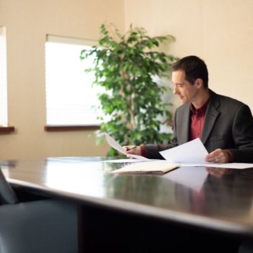 woman and man standing in office